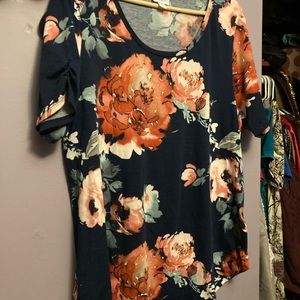 Lularoe top with rounded neck.